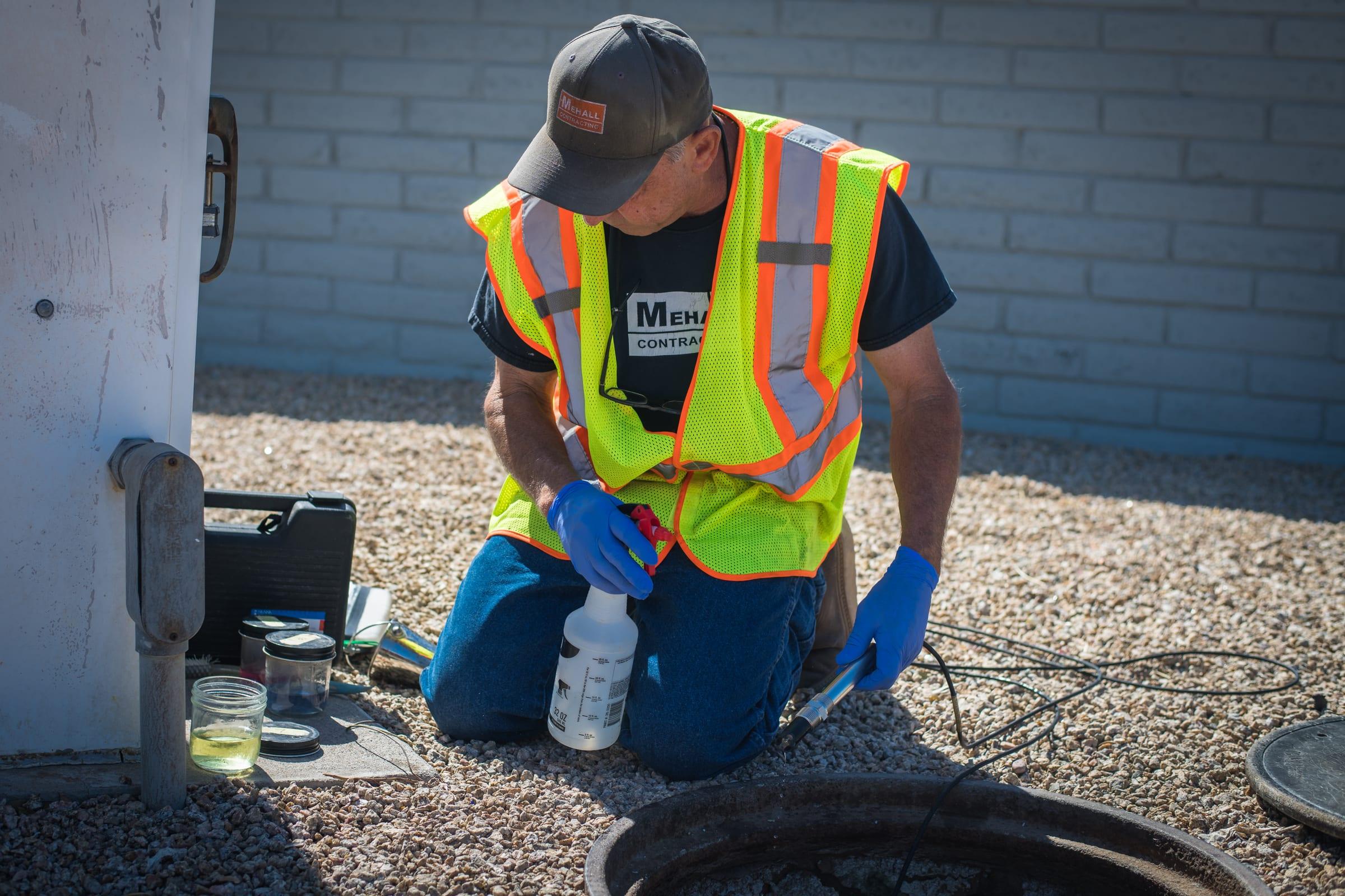 Technician preparing water samples at an industrial site
